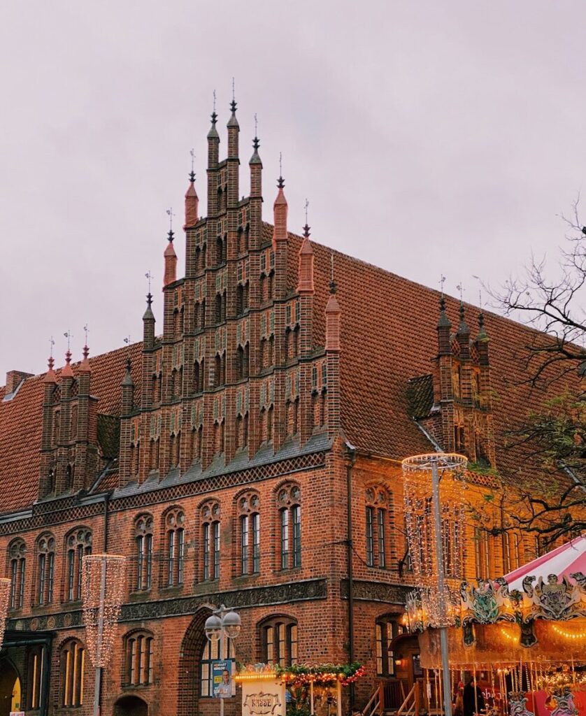 brown brick building under white sky during daytime